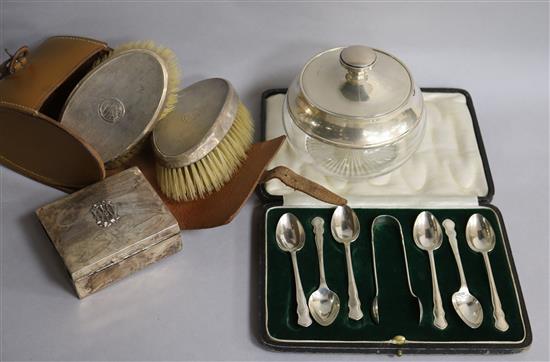 A silver cigarette box, cased set of spoons, cased pair of clothes brushes and a silver mounted powder jar.